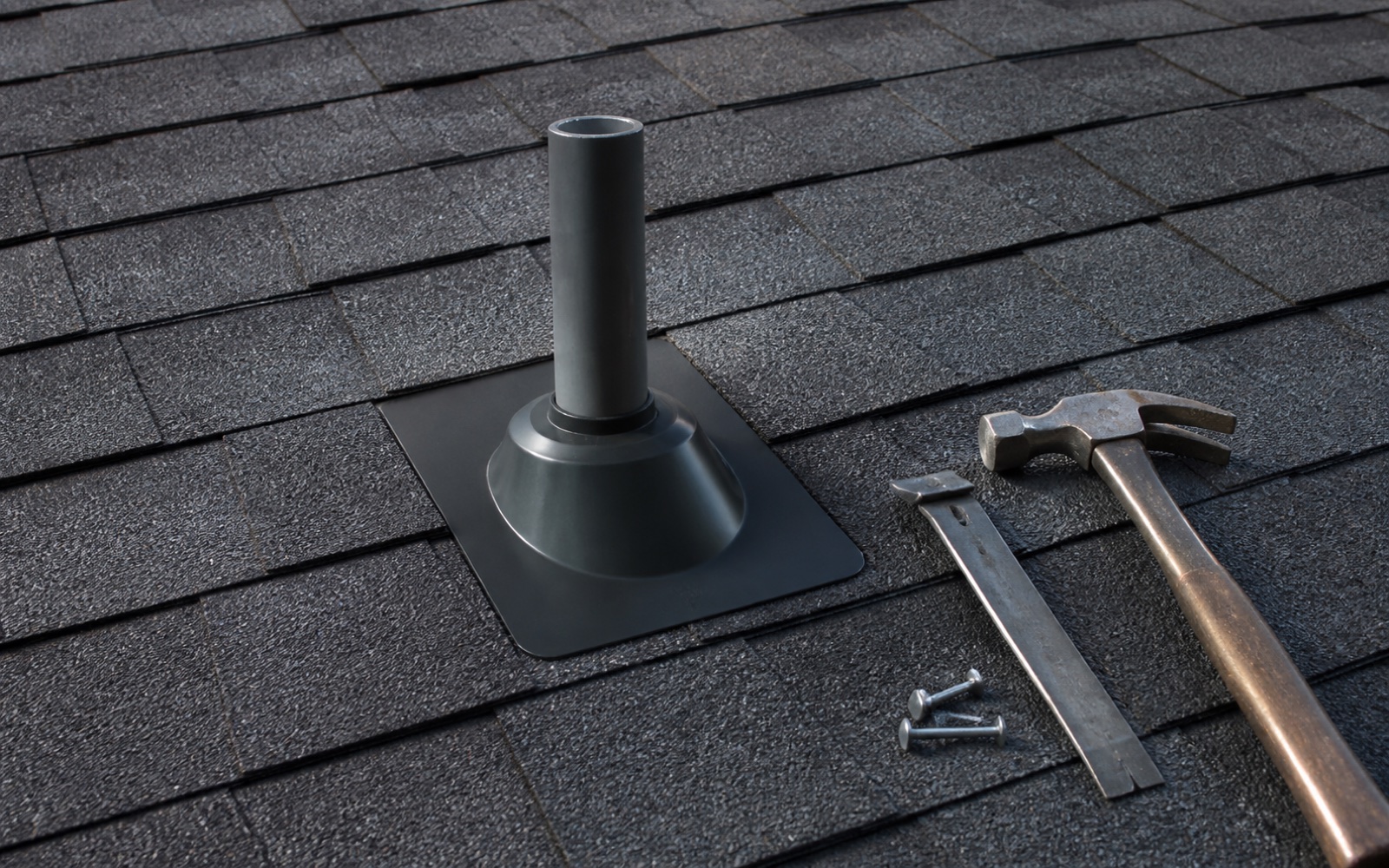 New shingles and flashing completing a localized roof repair on a North Dakota home